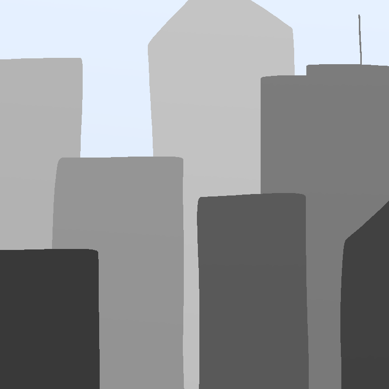 Gray city buildings against the blue sky.