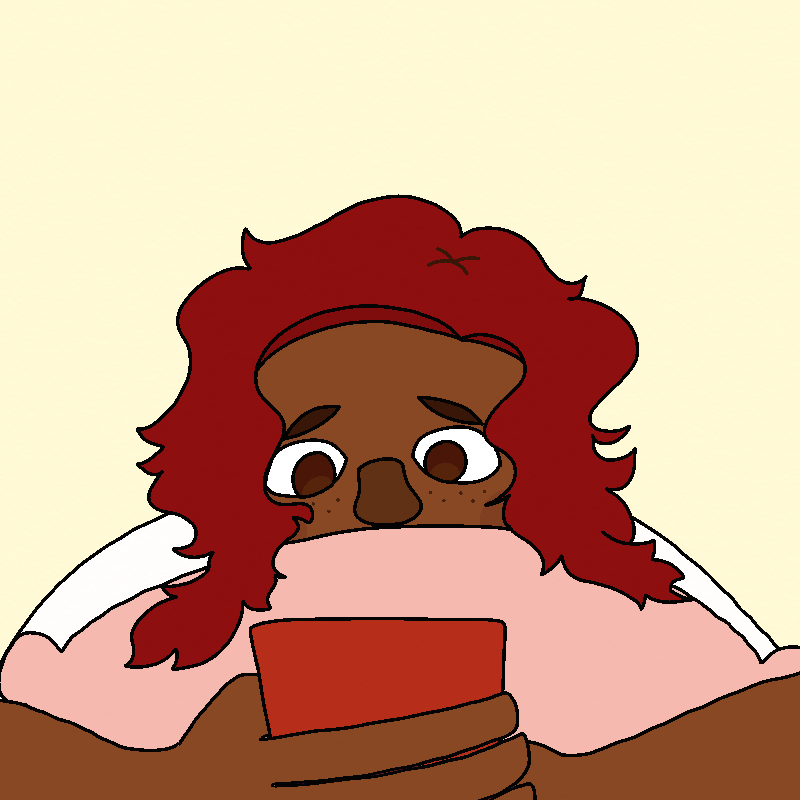 Amada hugs her pillow to her face with one arm, looking down at her phone with the other, still lying on her stomach in bed.